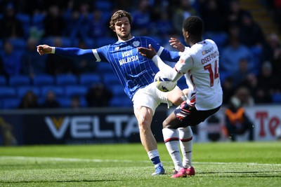 110426 - Cardiff City v Bolton Wanderers - Sky Bet League 1 - Ollie Tanner of Cardiff City has his shot blocked by Jordi Osei-Tutu of Bolton