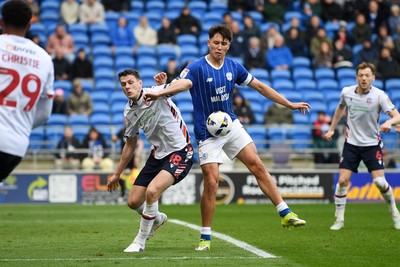 110426 - Cardiff City v Bolton Wanderers - Sky Bet League 1 - Rubin Colwill of Cardiff City is challenged by Eoin Toal of Bolton