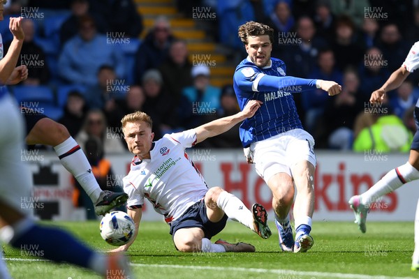 110426 - Cardiff City v Bolton Wanderers - Sky Bet League 1 - Ollie Tanner of Cardiff City has his shot blocked by Sam Dalby of Bolton
