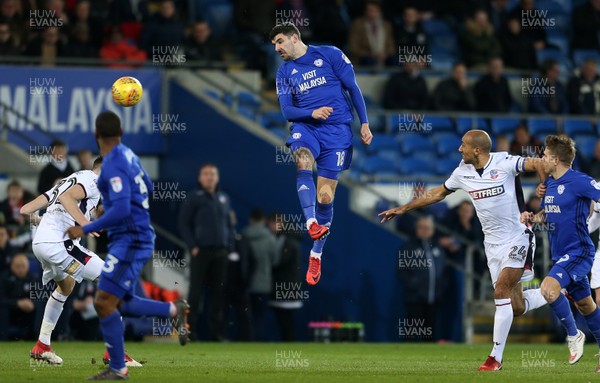 130218 - Cardiff City v Bolton Wanderers - SkyBet Championship - Callum Paterson of Cardiff City headers the ball