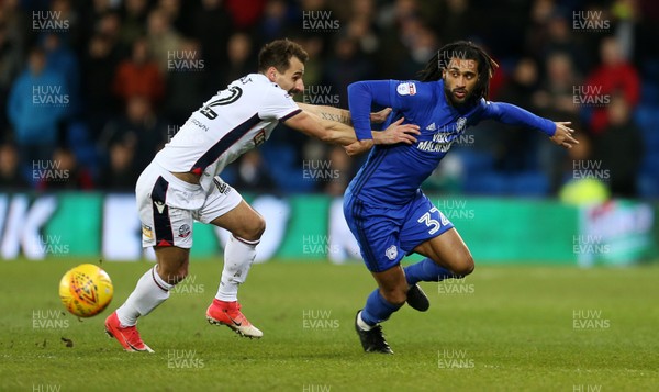 130218 - Cardiff City v Bolton Wanderers - SkyBet Championship - Armand Traore of Cardiff City is challenged by Filipe Morais of Bolton Wanderers