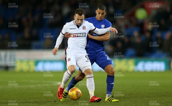 130218 - Cardiff City v Bolton Wanderers - SkyBet Championship - Adam Le Fondre of Bolton Wanderers is challenged by Lee Peltier of Cardiff City