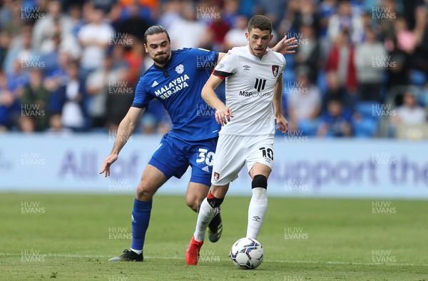 180921 - Cardiff City v Bournemouth, Sky Bet Championship - Ryan Christie of Bournemouth holds off Ciaron Brown of Cardiff City