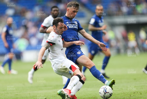 180921 - Cardiff City v Bournemouth, Sky Bet Championship - Mark Harris of Cardiff City and Adam Smith of Bournemouth compete for the ball