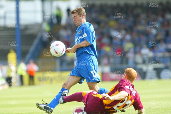 160803 - Cardiff City v Bradford City - Division One - Cardiff's Willie Boland beats Wayne Jacob's tackle