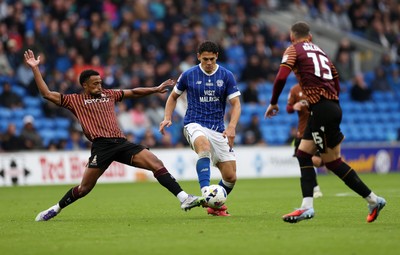 200925 - Cardiff City v Bradford City - SkyBet League One - Yousef Salech of Cardiff City is tackled by Ibou Touray of Bradford City 