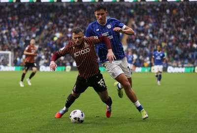 200925 - Cardiff City v Bradford City - SkyBet League One - Aden Baldwin of Bradford City is tackled by Rubin Colwill of Cardiff City 