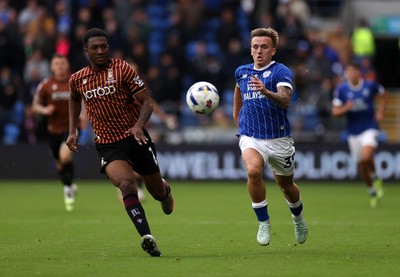 200925 - Cardiff City v Bradford City - SkyBet League One - Isaak Davies of Cardiff City is challenged by Josh Neufville of Bradford City 