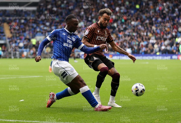 200925 - Cardiff City v Bradford City - SkyBet League One - Ronan Kpakio of Cardiff City is challenged by Tyreik Wright of Bradford City 