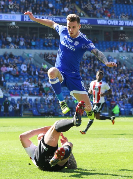 080417 - Cardiff City v Brentford, Sky Bet Championship - Joe Ralls of Cardiff City jumps out of the challenge from Harlee Dean of Brentford