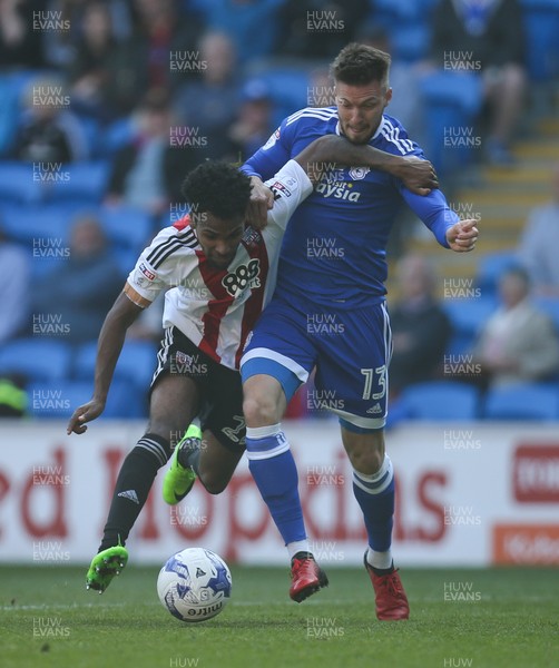 080417 - Cardiff City v Brentford, Sky Bet Championship - Anthony Pilkington of Cardiff City and Rico Henry of Brentford compete for the ball