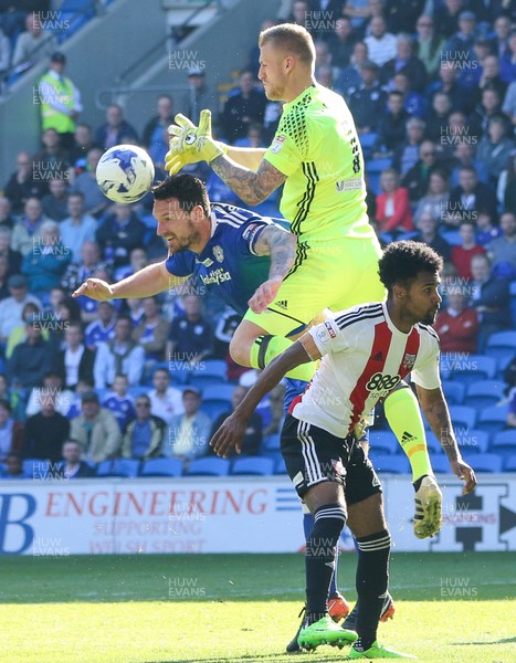 080417 - Cardiff City v Brentford, Sky Bet Championship - Brentford goalkeeper Daniel Bentley claims the ball from Sean Morrison of Cardiff City