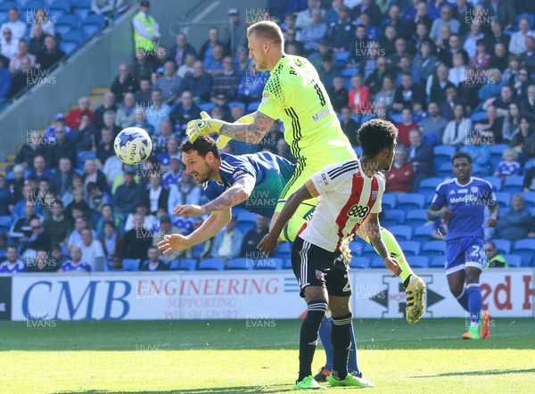 080417 - Cardiff City v Brentford, Sky Bet Championship - Brentford goalkeeper Daniel Bentley claims the ball from Sean Morrison of Cardiff City