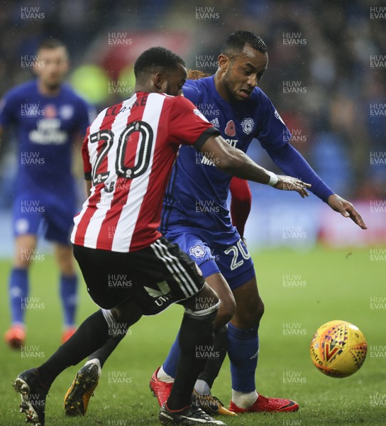 181117 - Cardiff City v Brentford, Sky Bet Championship - Loic Damour of Cardiff City and Josh Clarke of Brentford compete for the ball