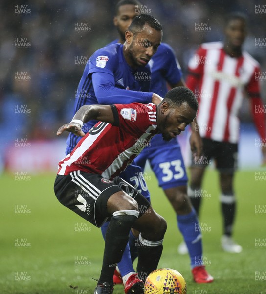 181117 - Cardiff City v Brentford, Sky Bet Championship - Loic Damour of Cardiff City and Josh Clarke of Brentford compete for the ball