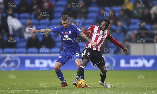 181117 - Cardiff City v Brentford, Sky Bet Championship - Joe Bennett of Cardiff City and Florian Jozefzoon of Brentford compete for the ball