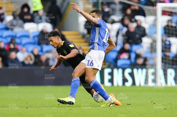 290220 - Cardiff City v Brentford, Sky Bet Championship - Curtis Nelson of Cardiff City tackles Ollie Watkins of Brentford