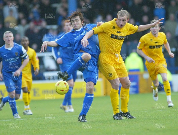 120205 - Cardiff City v Brighton & Hove Albion - Cardiff's Junichi Inamoto wins the ball from Richard Carpenter