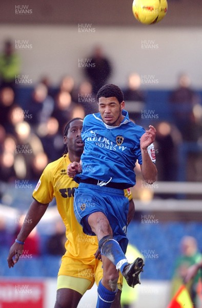 120205 - Cardiff City v Brighton & Hove Albion - Cardiff's Jobi McAnuff beats Mark McCammonto a high ball