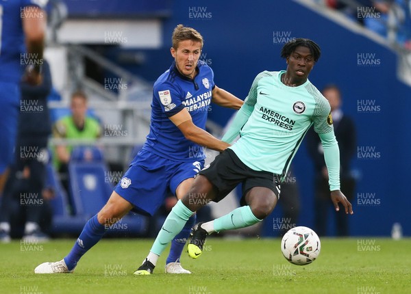 240821 - Cardiff City v Brighton and Hove Albion, EFL Carabao Cup - Taylor Richards of Brighton and Will Vaulks of Cardiff City compete for the ball