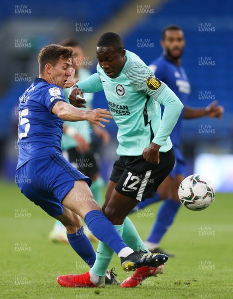 240821 - Cardiff City v Brighton and Hove Albion, EFL Carabao Cup - Ryan Wintle of Cardiff City and Enock Mwepu of Brighton compete for the ball