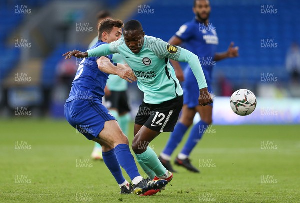 240821 - Cardiff City v Brighton and Hove Albion, EFL Carabao Cup - Ryan Wintle of Cardiff City and Enock Mwepu of Brighton compete for the ball