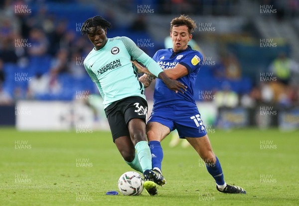 240821 - Cardiff City v Brighton and Hove Albion, EFL Carabao Cup - Ryan Wintle of Cardiff City challenges Taylor Richards of Brighton