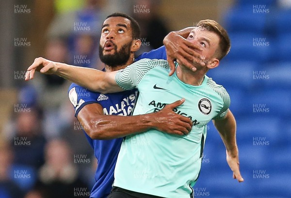 240821 - Cardiff City v Brighton and Hove Albion, EFL Carabao Cup - Curtis Nelson of Cardiff City and Marc Leonard of Brighton tangle as they compete for the ball