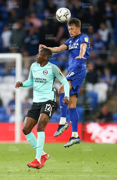 240821 - Cardiff City v Brighton and Hove Albion, EFL Carabao Cup - Perry Ng of Cardiff City wins the ball from Enock Mwepu of Brighton