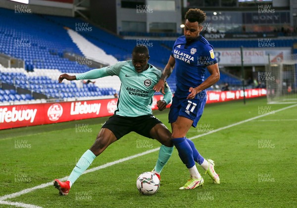240821 - Cardiff City v Brighton and Hove Albion, EFL Carabao Cup - Josh Murphy of Cardiff City and Enock Mwepu of Brighton compete for the ball