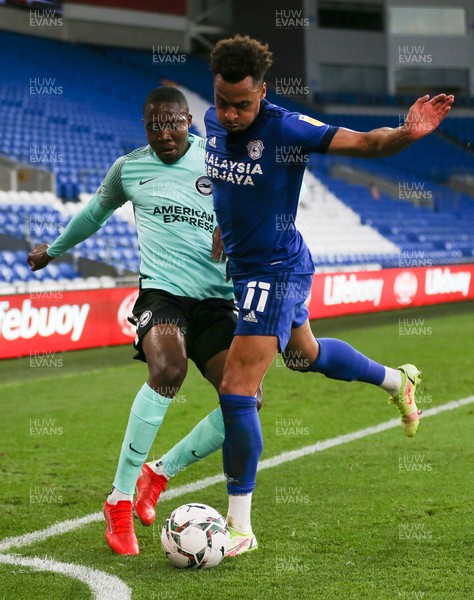 240821 - Cardiff City v Brighton and Hove Albion, EFL Carabao Cup - Josh Murphy of Cardiff City and Enock Mwepu of Brighton compete for the ball