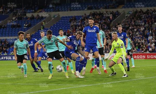 240821 - Cardiff City v Brighton and Hove Albion, EFL Carabao Cup - Aden Flint of Cardiff City looks to win the ball back after he heads at goal but its saved by Brighton goalkeeper Jason Steele