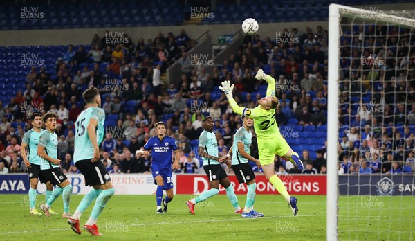 240821 - Cardiff City v Brighton and Hove Albion, EFL Carabao Cup - Perry Ng of Cardiff City sees his shot at goal saved by Jason Steele of Brighton