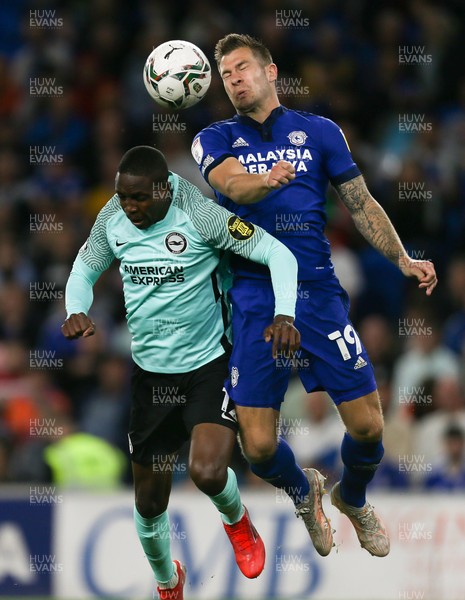 240821 - Cardiff City v Brighton and Hove Albion, EFL Carabao Cup - James Collins of Cardiff City and Enock Mwepu of Brighton compete for the ball