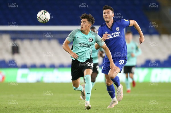 240821 - Cardiff City v Brighton and Hove Albion, EFL Carabao Cup - Haydon Roberts of Brighton and Kieffer Moore of Cardiff City compete for the ball