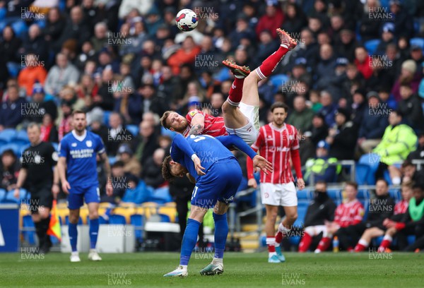 040323 - Cardiff City v Bristol City, EFL Sky Bet Championship - Tomas Kalas of Bristol City takes a fall as he goes over the top of Connor Wickham of Cardiff City