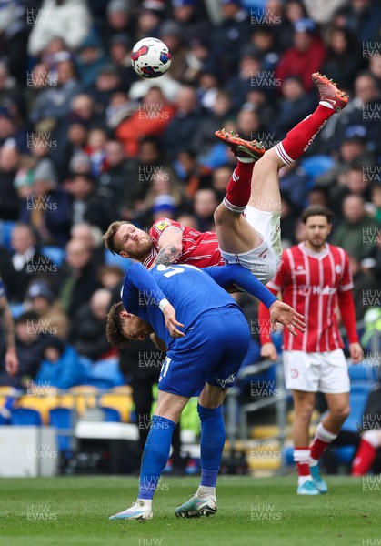 040323 - Cardiff City v Bristol City, EFL Sky Bet Championship - Tomas Kalas of Bristol City takes a fall as he goes over the top of Connor Wickham of Cardiff City