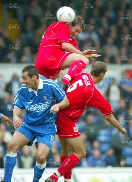 100503 - Cardiff City v Bristol City - Division Two Playoff Semi Final First Leg - Bristol City's Lee Peacock outjumps both Peter Thorne and team mate Tony Butler