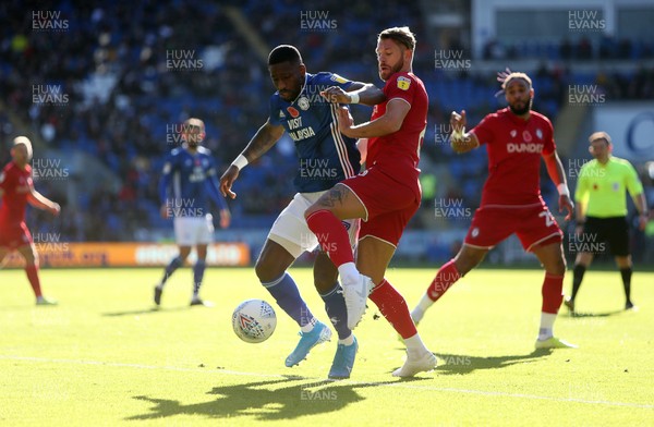 101119 - Cardiff City v Bristol City - SkyBet Championship - Omar Bogle of Cardiff City is tackled by Nathan Baker of Bristol City