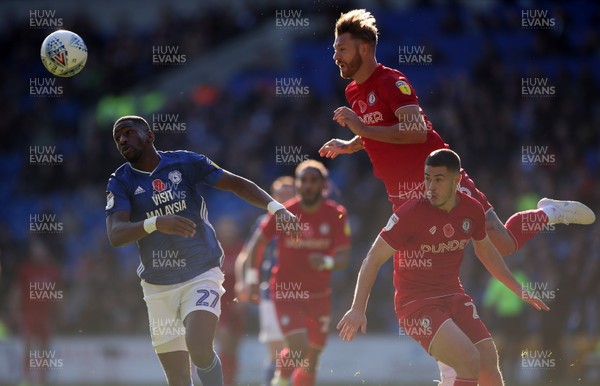 101119 - Cardiff City v Bristol City - SkyBet Championship - Nathan Baker of Bristol City headers the ball away from Omar Bogle of Cardiff City