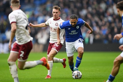 150225 - Cardiff City v Bristol City - Sky Bet Championship - Andy Rinomhota of Cardiff City is challenged by Scott Twine of Bristol City