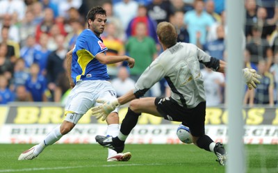 23.08.09 - Cardiff City v Bristol City - Coca-Cola Championship - Joe Ledley of Cardiff City takes on Dean Gerken of Bristol City. 