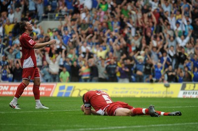 23.08.09 - Cardiff City v Bristol City - Coca-Cola Championship - Jamie McCombe of Bristol City lies dejected on the ground after scoring an own goal. 