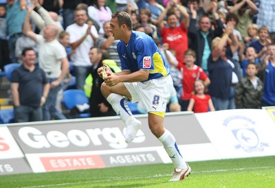 23.08.09 - Cardiff City v Bristol City, Coca Cola Championship -  Cardiff's Michael Chopra removes his "hot" right foot boot as he celebrates goal 
