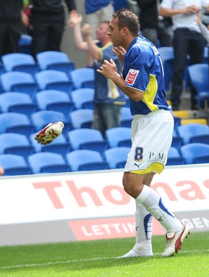 23.08.09 - Cardiff City v Bristol City, Coca Cola Championship -  Cardiff's Michael Chopra drops his "hot" right foot boot as he celebrates goal 