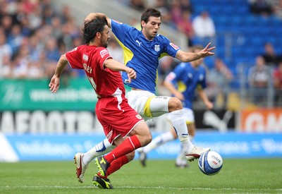 23.08.09 - Cardiff City v Bristol City, Coca Cola Championship -  Cardiff's Joe Ledley challenges Bristol's Paul Hartley  