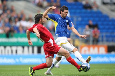 23.08.09 - Cardiff City v Bristol City, Coca Cola Championship -  Cardiff's Joe Ledley challenges Bristol's Paul Hartley  