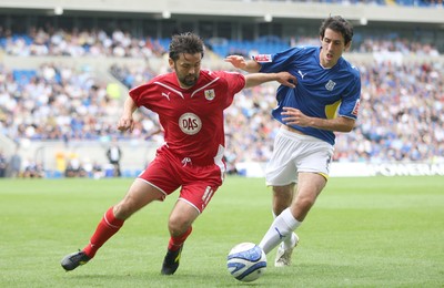 23.08.09 - Cardiff City v Bristol City, Coca Cola Championship -  Bristol's Paul Hartley holds off Cardiff's Peter Whittingham  