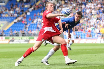 23.08.09 - Cardiff City v Bristol City, Coca Cola Championship -  Cardiff's Paul Quinn and Bristol's Brian Wilson compete for the ball 