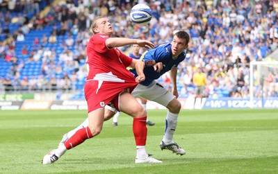 23.08.09 - Cardiff City v Bristol City, Coca Cola Championship -  Cardiff's Paul Quinn and Bristol's Brian Wilson compete for the ball 